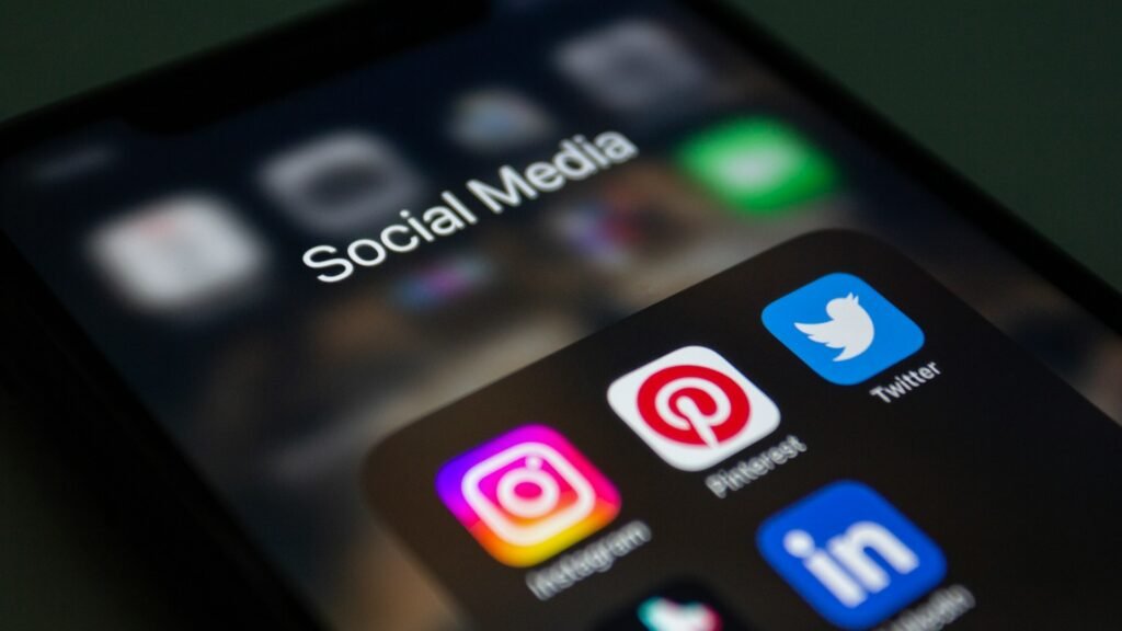 social media logos and apps on iphone screen
