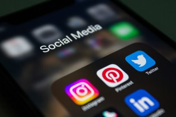 social media logos and apps on iphone screen